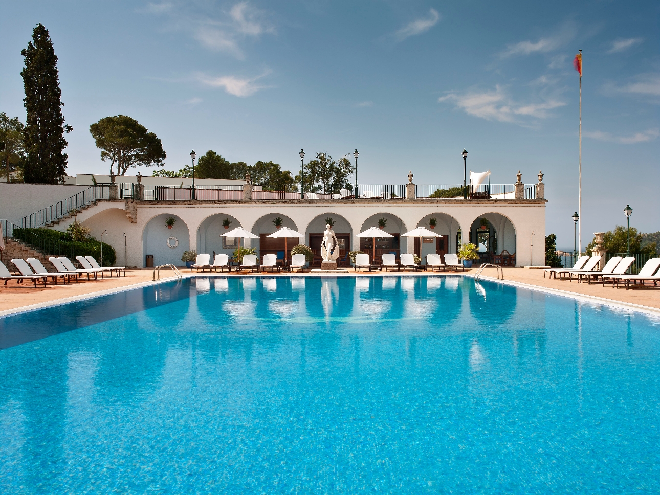 outdoor pool with terrace and sunloungers